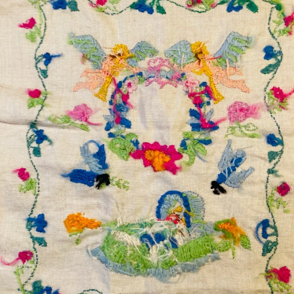 Beautiful small sampler of newborn child, knitted in colorful needlework linen